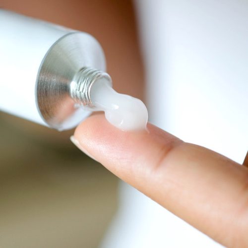 topical compounded cream being applied to the finger